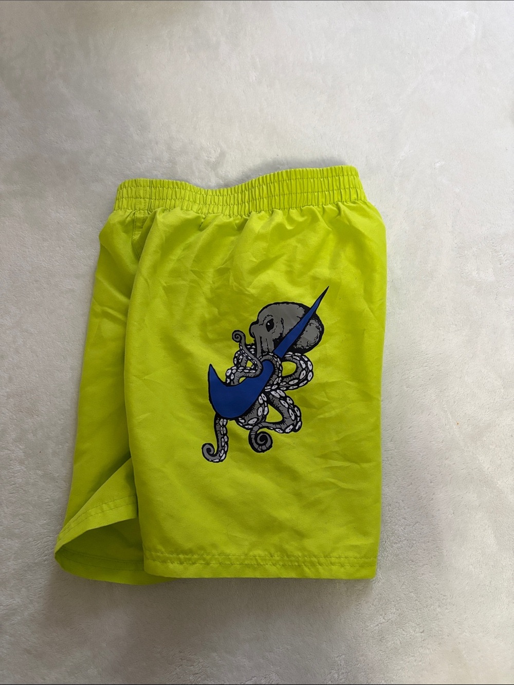 Nike Neon Yellow Kids Swim Trunks with Blue Octopus Graphic